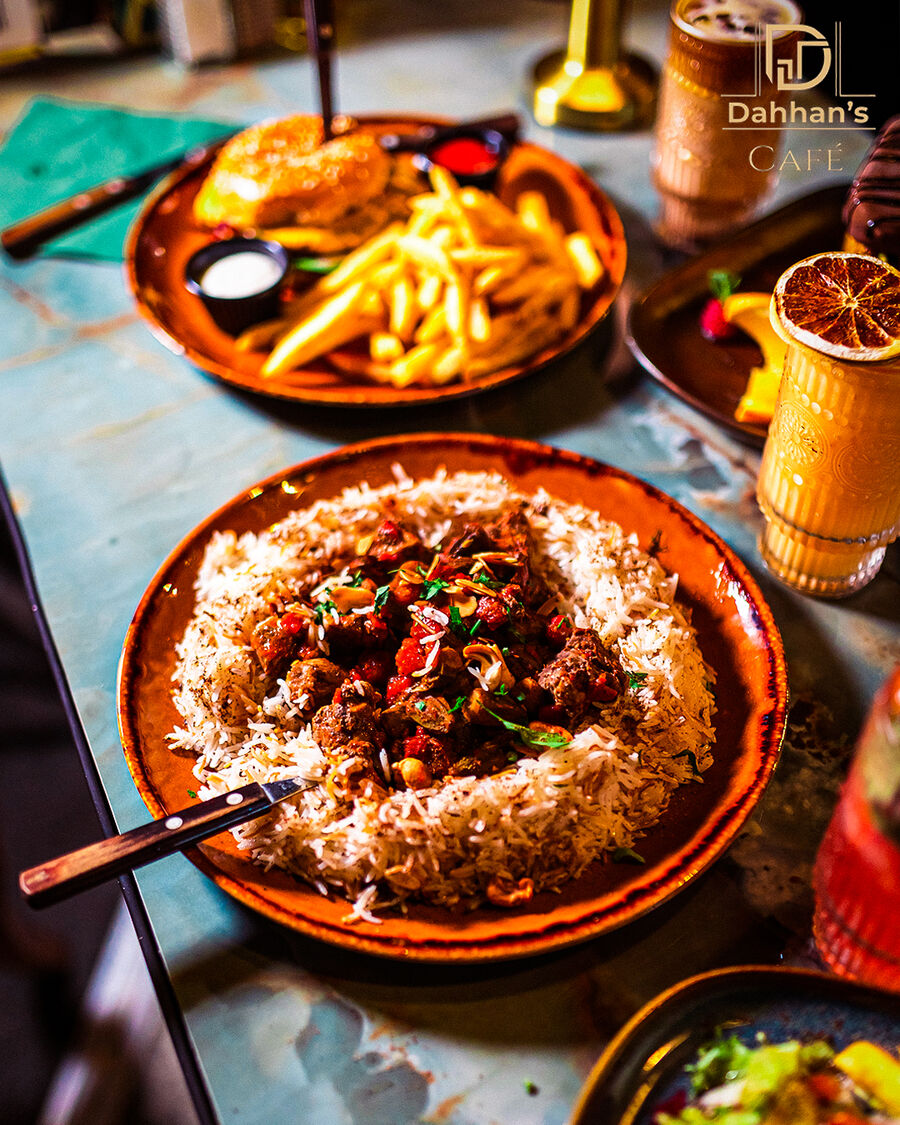 Tender lamb over spiced rice with toasted nuts